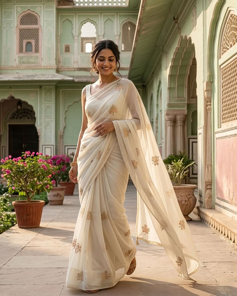 Pastel green maple leaf emb georgette saree